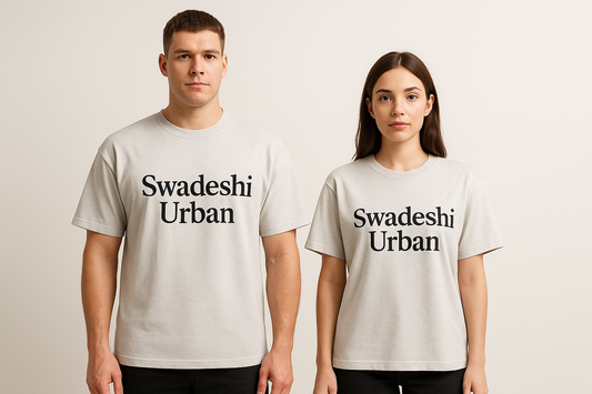 A 3D male & female avatar both wearing the same tee, showing how the unisex oversized fit looks across body types. with write up Swadeshi Urban